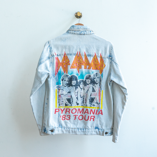 back of authentic Def Leppard jeans jacket with design on the back of def leppard band members name of the band and text 'Pyromania '83 Tour' in red yellow black and white and blue fresh vintage