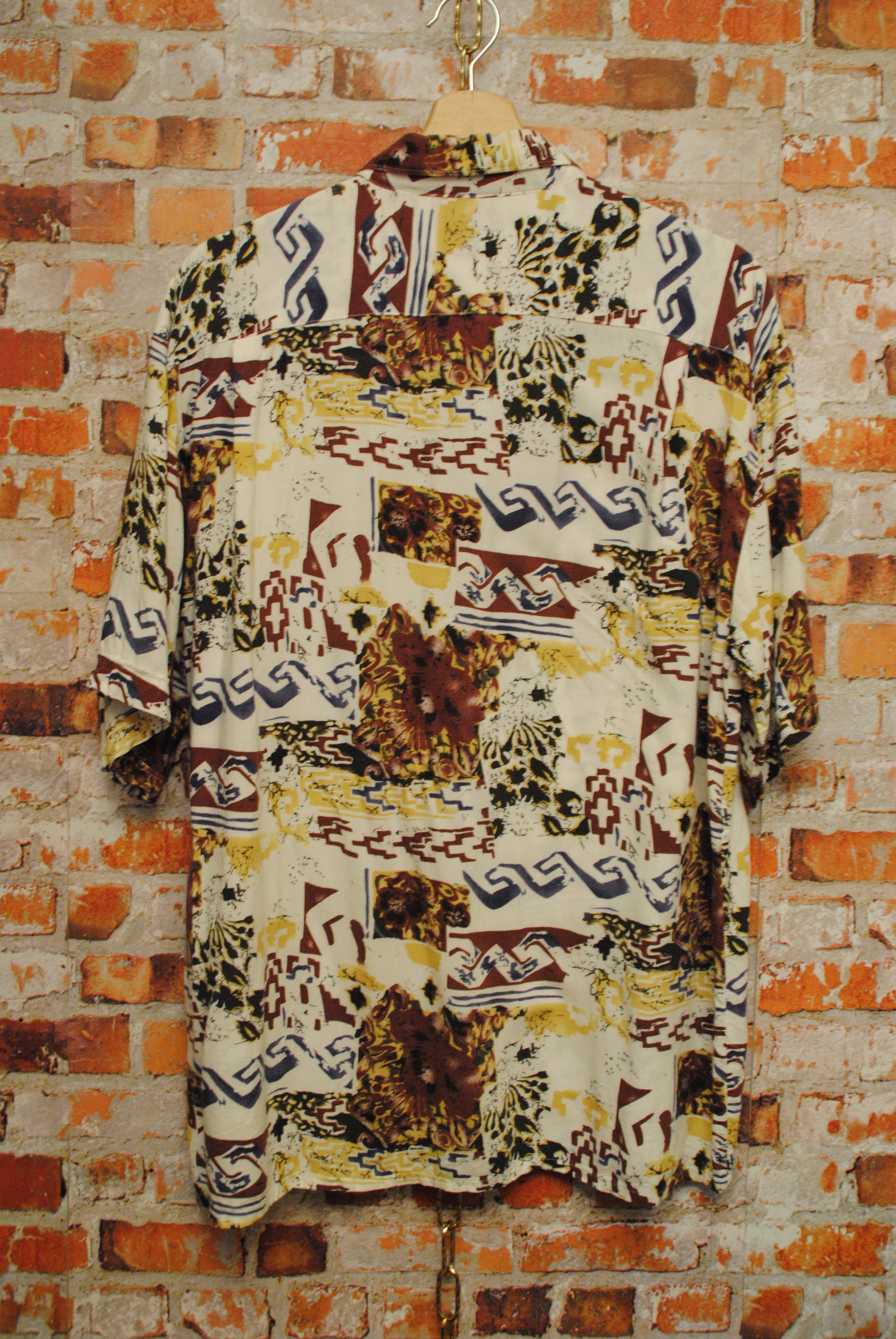 Vintage Shirt Hanging Against Brick Wall
